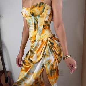 Orange and yellow corset top and skirt set from Pretty little thing